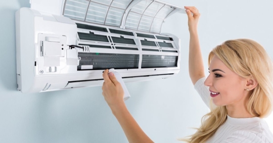 Woman looking at a ductless mini split