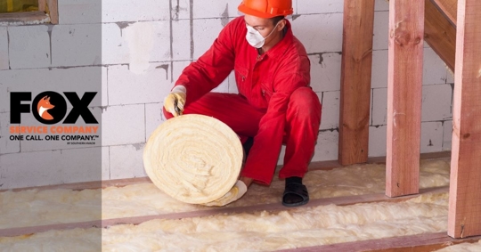 Person installing insulation